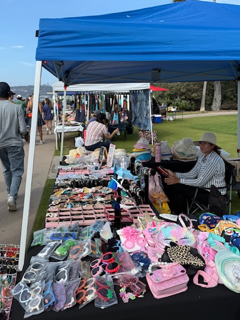 Selling cheap sunglasses, like Kobies Swap Meet